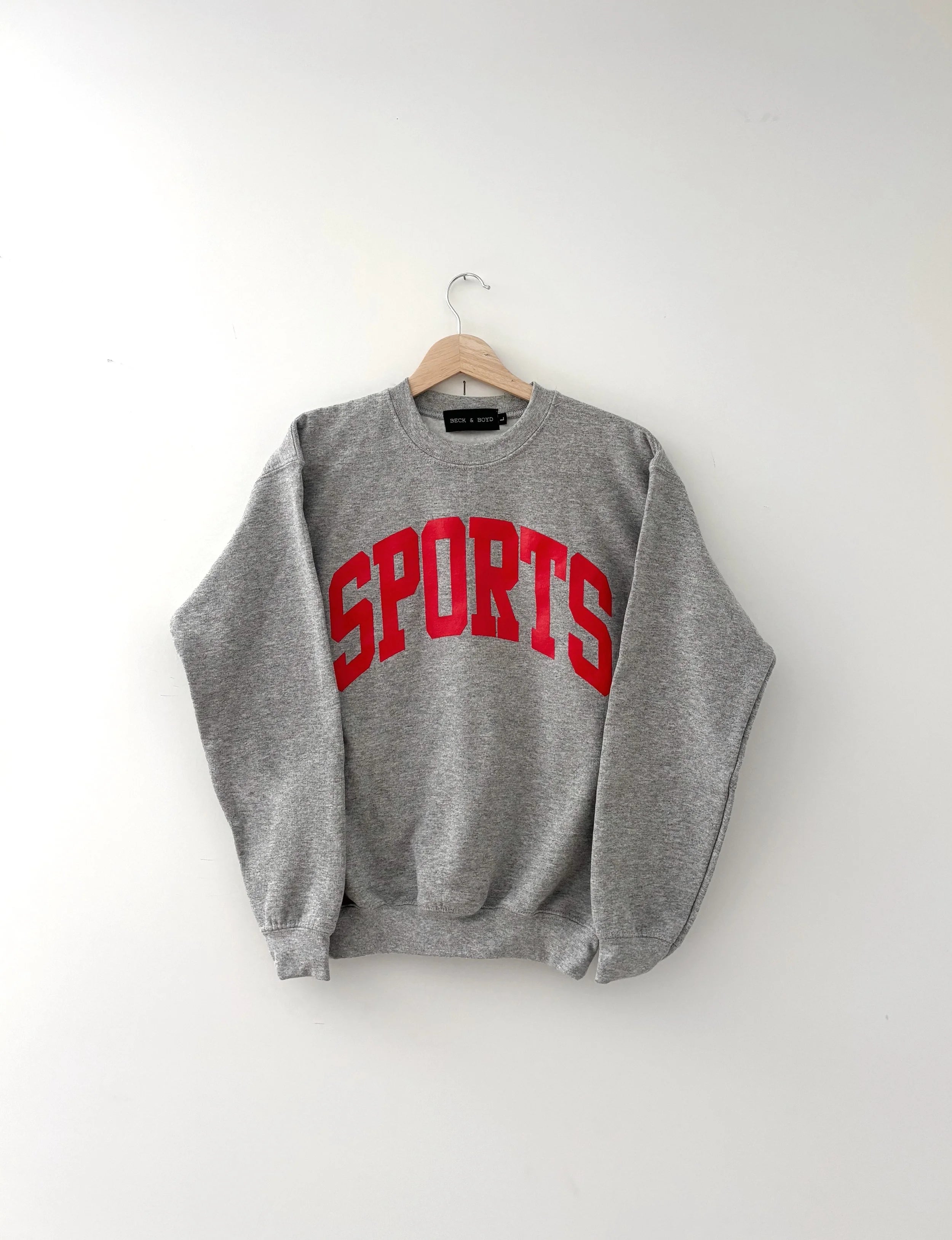 Grey kids sweatshirt with red 'SPORTS' text on a white background, sports, kids, fan, cozy, matching, adorable, sporty, sport