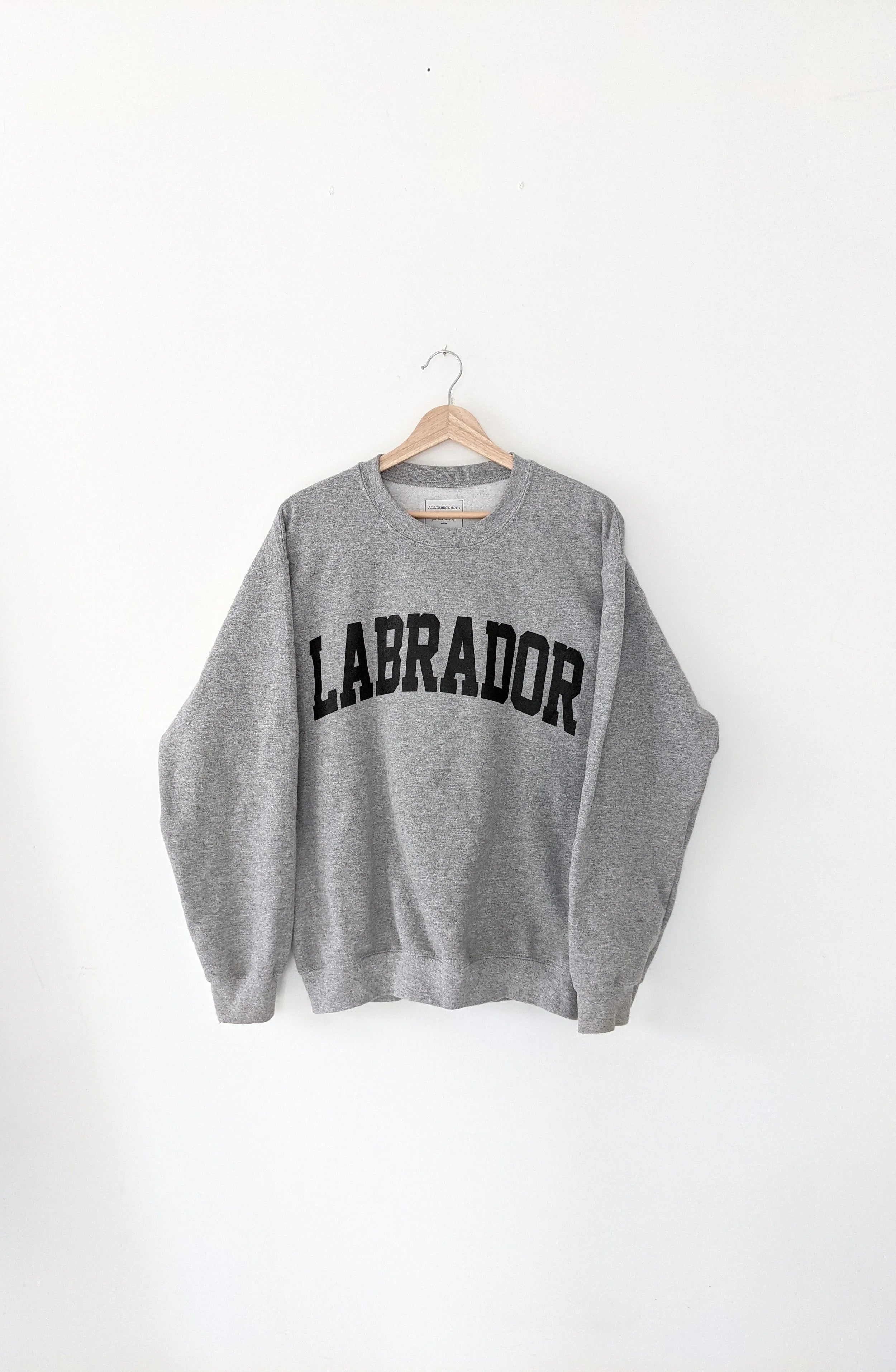 Grey sweatshirt with 'LABRADOR' text on a white background, labrador, atlantic provinces, maritimes, gift ideas, cozy
