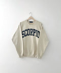 Beige sweatshirt with 'SCORPIO' text on a hanger against a white background, Zodiac, astrology, Birthday, Gift Ideas, Scorpio