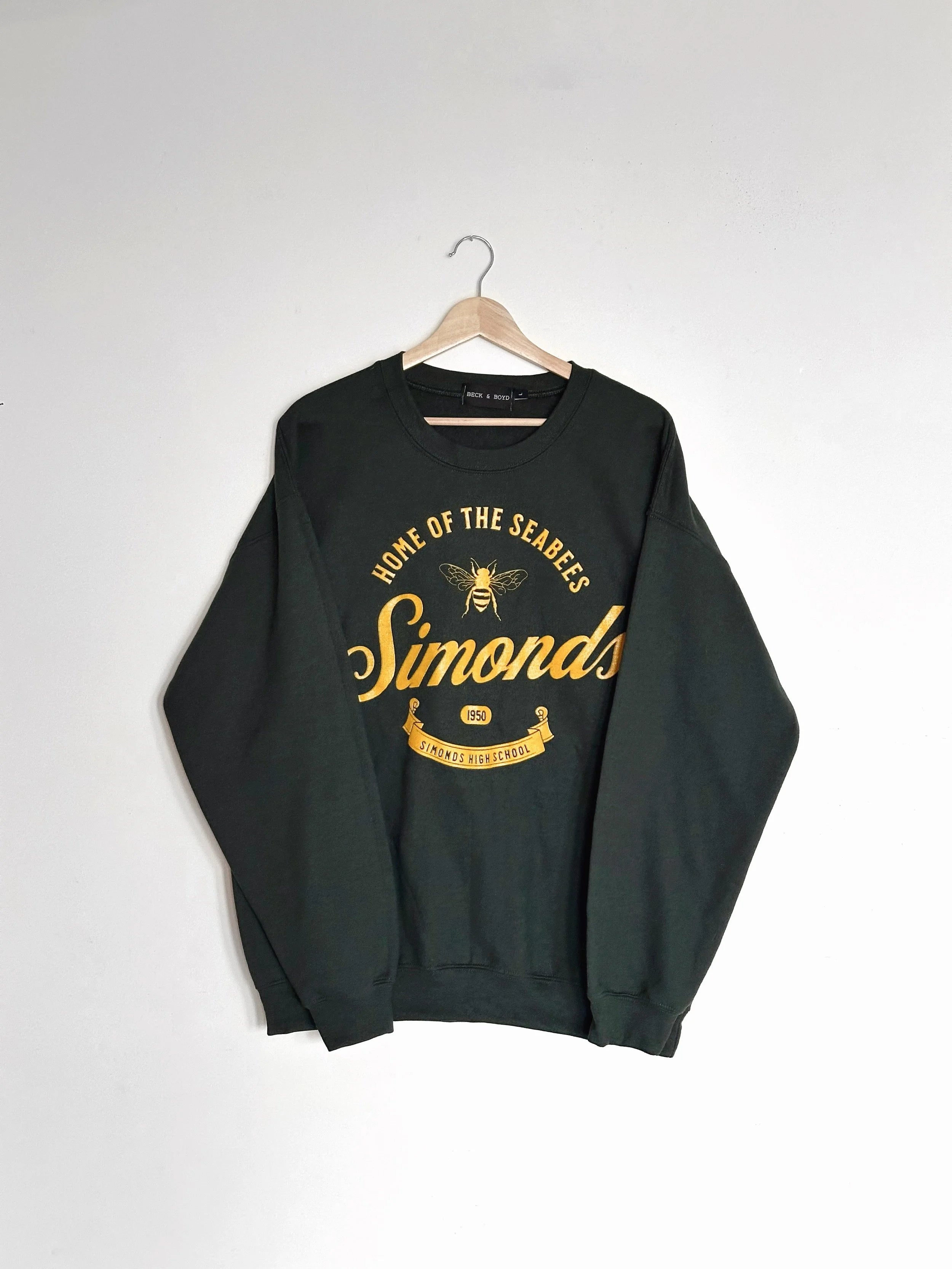 Dark green sweatshirt with yellow text and logo on a white background, School merch, Simonds High School, Sea bees, Vintage Design, Athletic